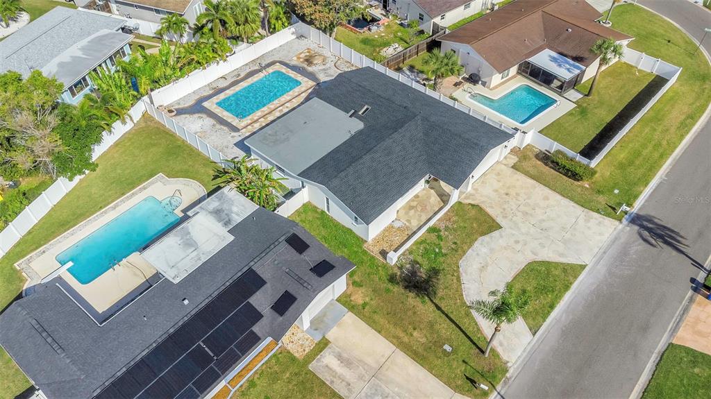 11419 47th Avenue North St. Petersburg, FL 33708 - Photo 80 of 94 an aerial view of a house with a swimming pool