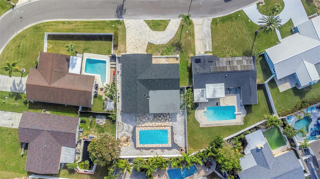11419 47th Avenue North St. Petersburg, FL 33708 - Photo 89 of 94 an aerial view of a house with a swimming pool