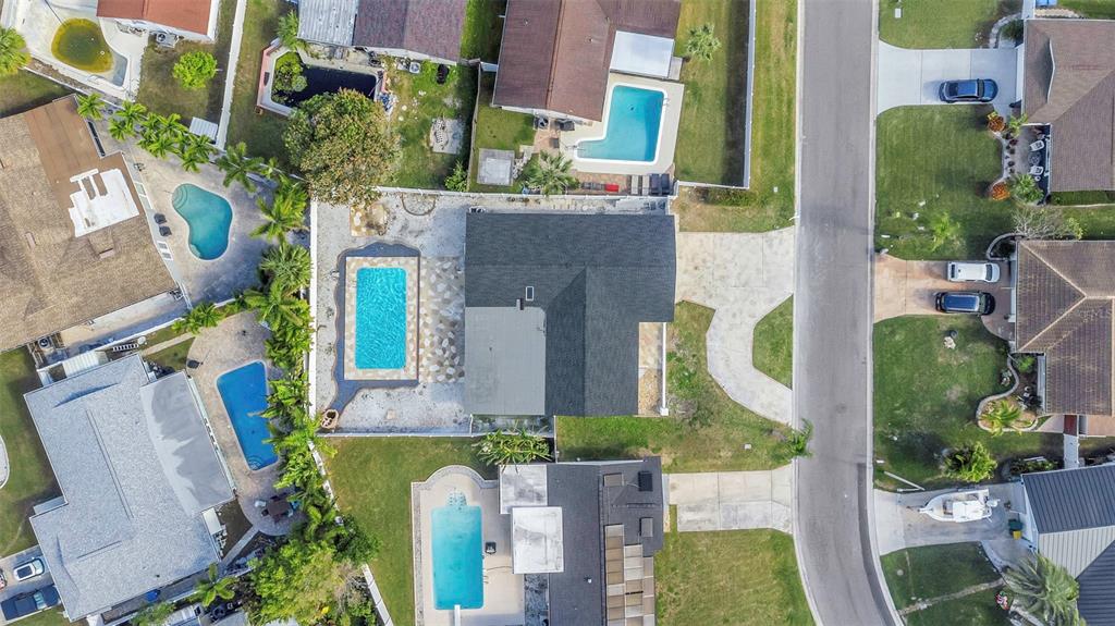 11419 47th Avenue North St. Petersburg, FL 33708 - Photo 90 of 94 an aerial view of a house with a yard and garden