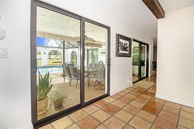 a view of a livingroom with a fireplace and wooden floor