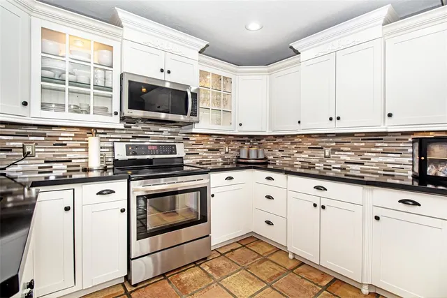a workspace with wooden floor and windows