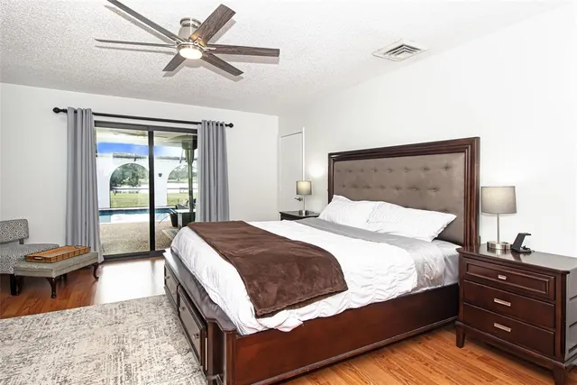 a white house that has a tree in front of it