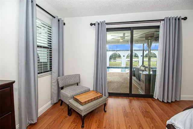 an aerial view of residential houses with outdoor space and swimming pool