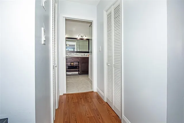 an aerial view of residential houses with outdoor space and swimming pool