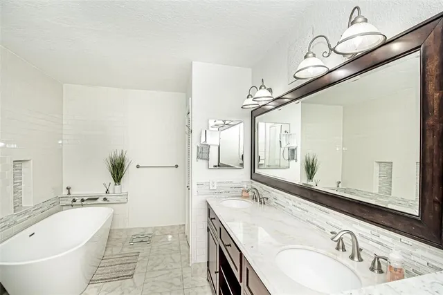 an aerial view of a house with a swimming pool yard and outdoor seating