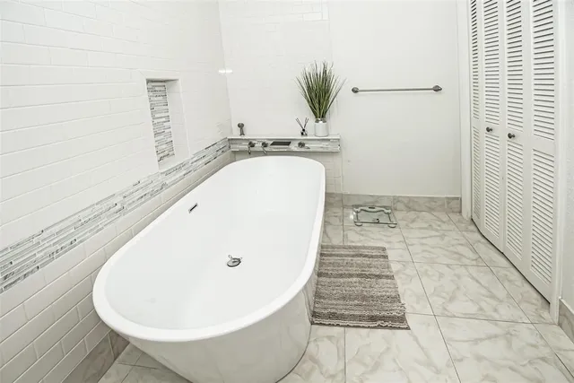 an aerial view of a house with a swimming pool yard and outdoor seating