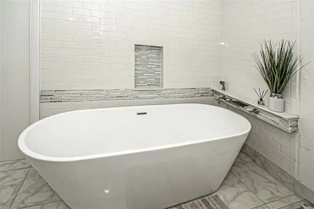 an aerial view of a house with a lake view