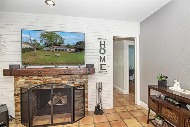 an aerial view of residential houses with outdoor space and lake view