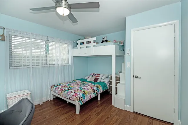 an aerial view of residential houses with outdoor space and swimming pool