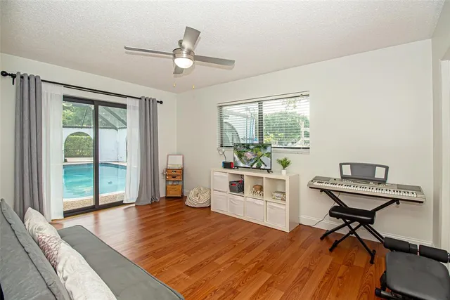an aerial view of residential houses with outdoor space and swimming pool