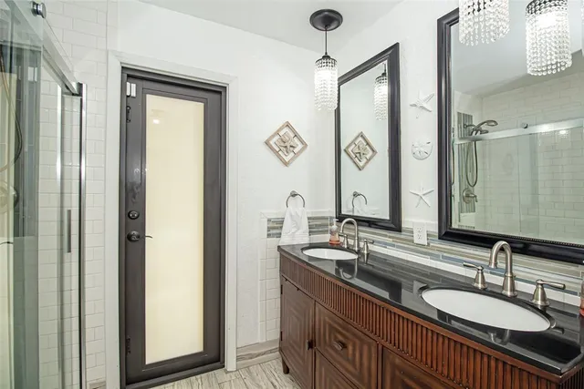 an aerial view of a house with a garden and lake view