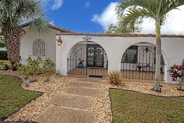 a kitchen with stainless steel appliances a refrigerator sink and microwave