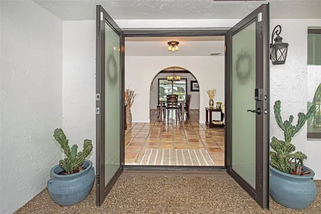 a living room with furniture and a clock