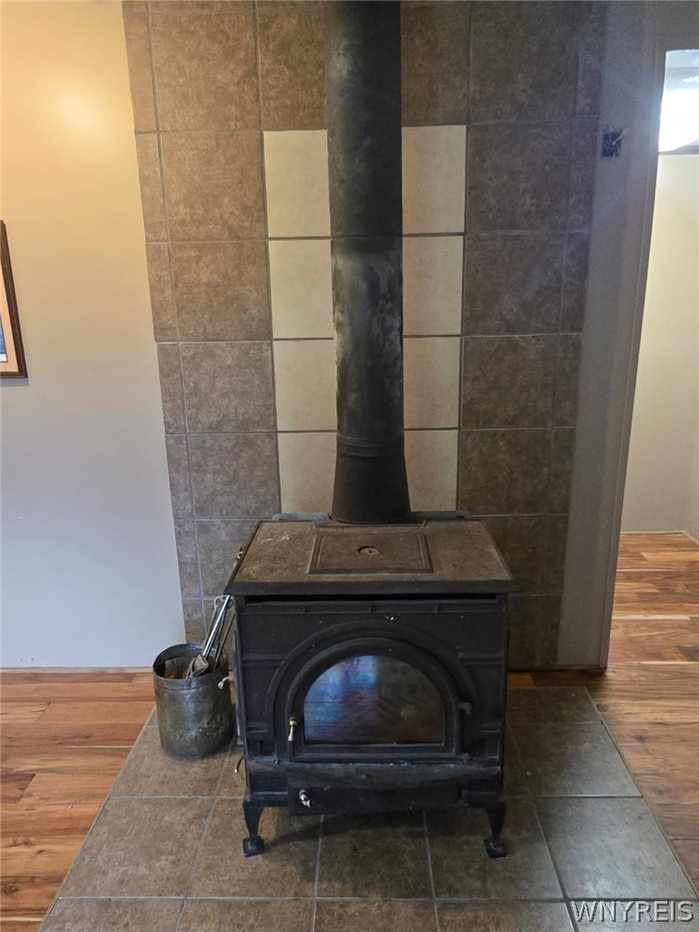 12507 Ridge Road Ridgeway, NY 14103 - Photo 15 of 22 wood burning stove in living room