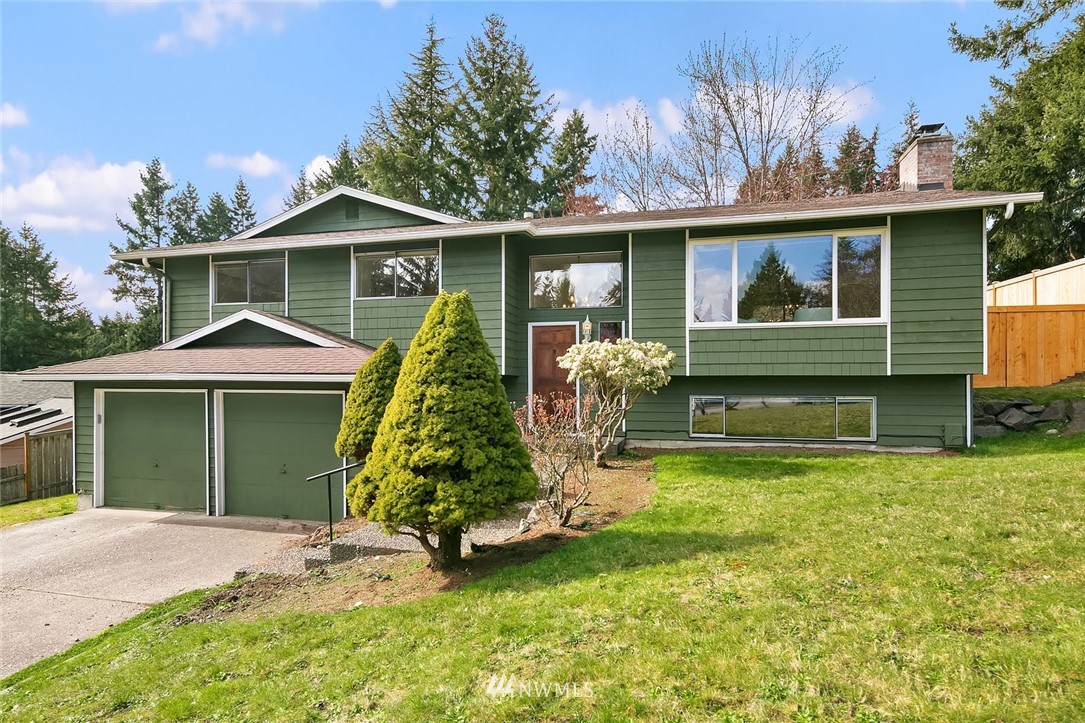 21900 Meridian Avenue South Bothell, WA 98021 - Photo 1 of 20 a front view of a house with a yard