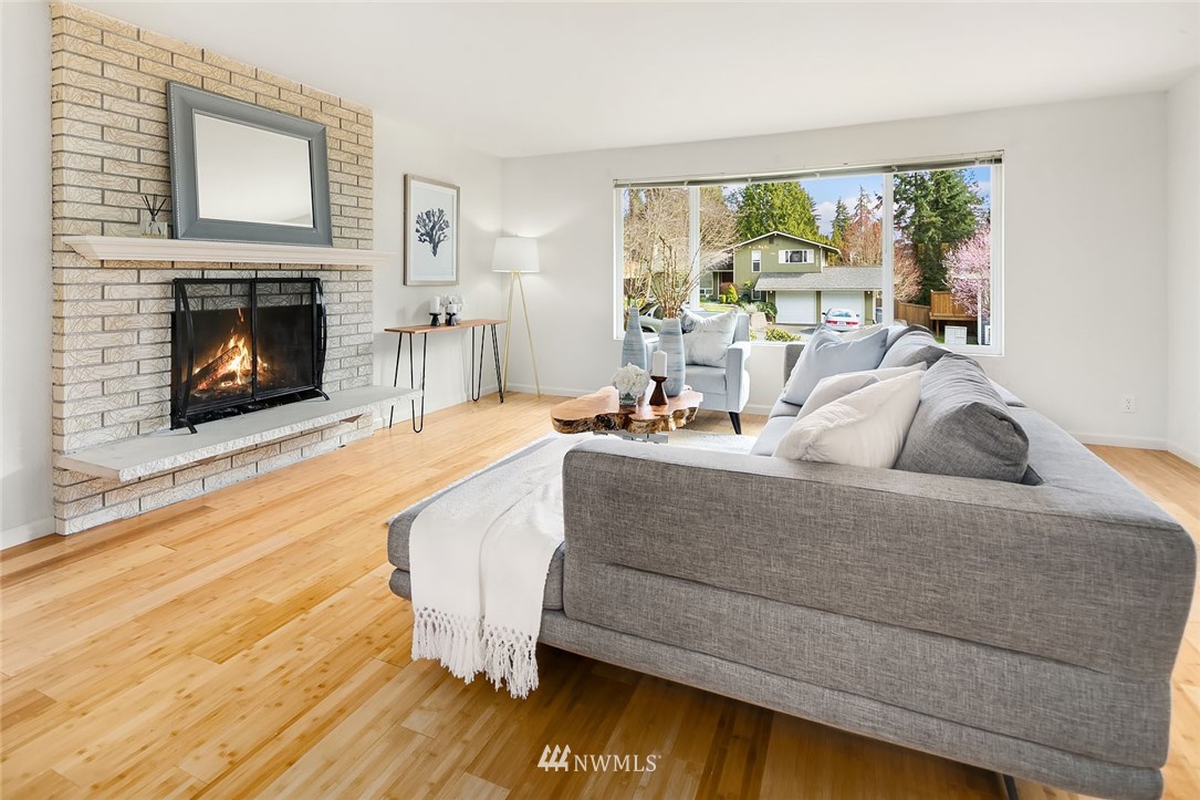 21900 Meridian Avenue South Bothell, WA 98021 - Photo 2 of 20 a living room with furniture and a fireplace
