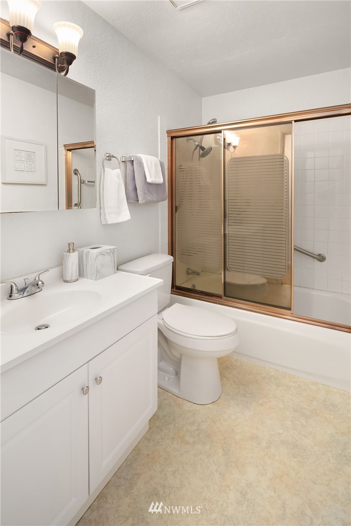 21900 Meridian Avenue South Bothell, WA 98021 - Photo 12 of 20 a bathroom with a sink a toilet and shower