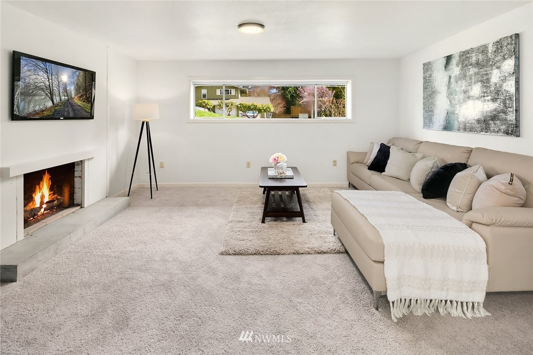 21900 Meridian Avenue South Bothell, WA 98021 - Photo 13 of 20 a bedroom with a bed and a fireplace