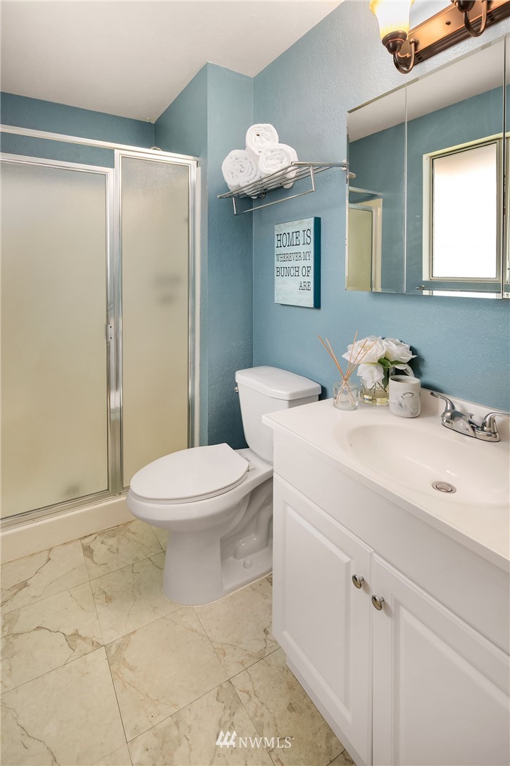 21900 Meridian Avenue South Bothell, WA 98021 - Photo 8 of 20 a bathroom with a sink a toilet and shower