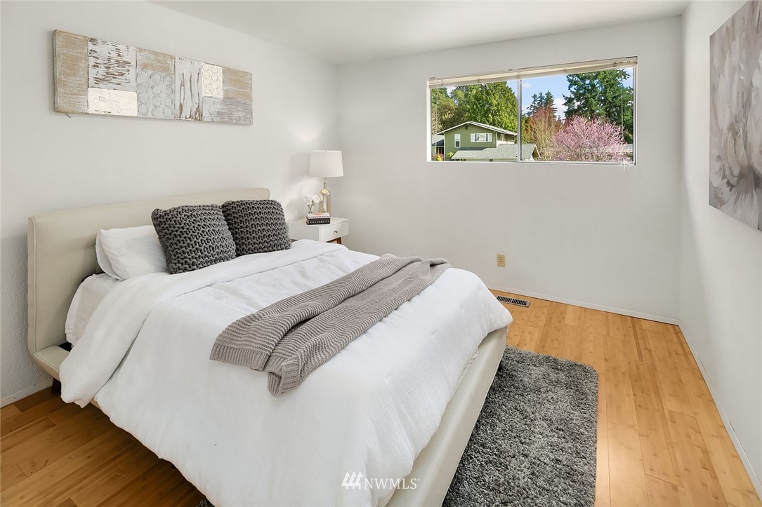 21900 Meridian Avenue South Bothell, WA 98021 - Photo 9 of 20 a bedroom with bed and wooden floor