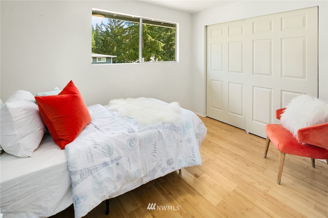 21900 Meridian Avenue South Bothell, WA 98021 - Photo 10 of 20 a bedroom with a bed a window and potted plant