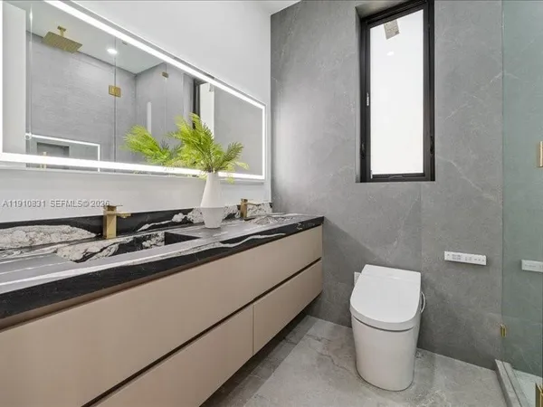 a bathroom with a sink and a toilet