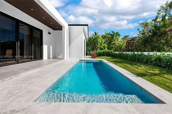 a view of swimming pool with a yard