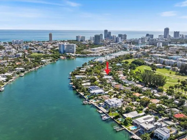an aerial view of a city with ocean view