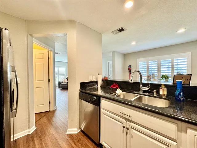 a kitchen with counter top space and stainless steel appliances
