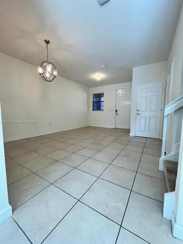 a view of a kitchen with electric appliances