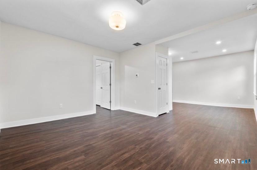 57 East Main Street, Unit 2 Branford, CT 06405 - Photo 15 of 17 a view of an empty room with wooden floor