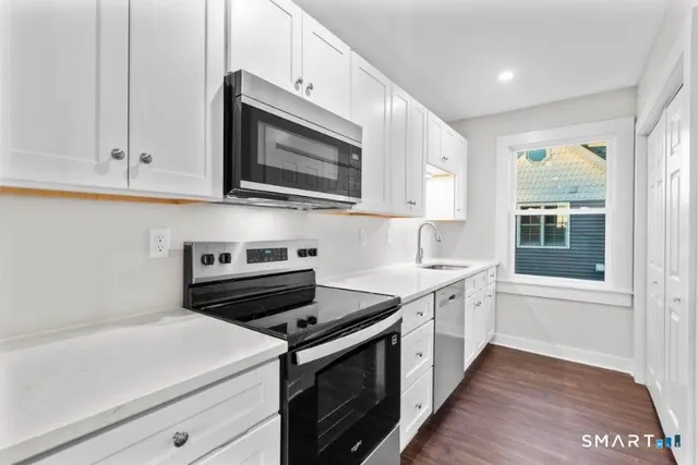 a kitchen with a stove and a microwave