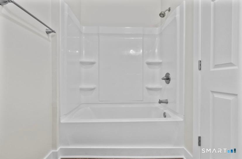 57 East Main Street, Unit 2 Branford, CT 06405 - Photo 7 of 17 a bathroom with bathtub and shower