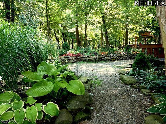 2040 Scroll Road Southwest Carrollton, OH 44615 - Photo 18 of 25 LOTS OF PATHS AND PERINNIELS ADORN THIS 20 ACRES!