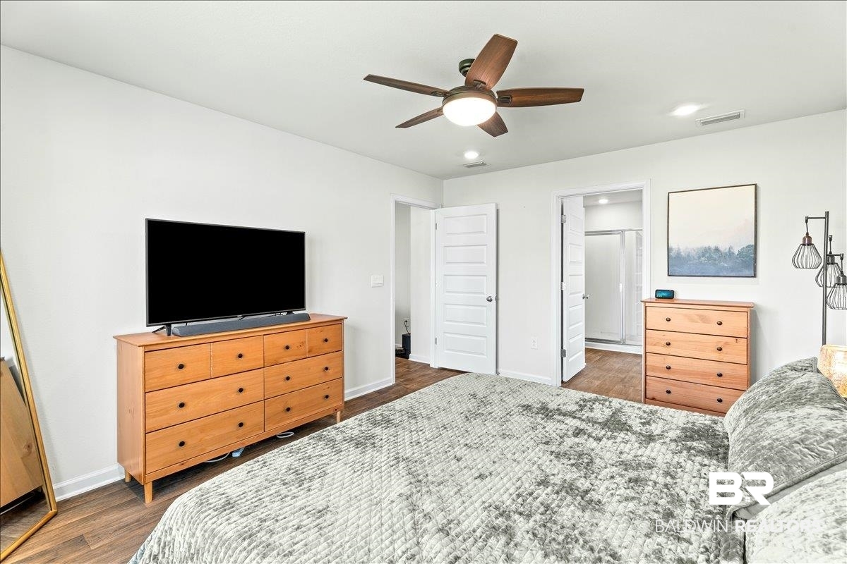 23641 Unbridled Loop Daphne, AL 36526 - Photo 19 of 40 Spacious room featuring wood-finish flooring and a ceiling fan with integrated lighting