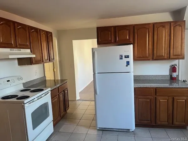 a kitchen with a refrigerator and a sink