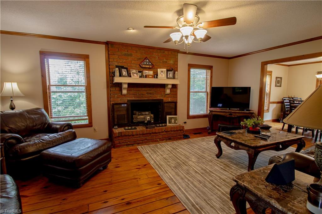 325 South Edgewood Road Eden, NC 27288 - Photo 2 of 29 living room with fireplace/gas logs, wood flooring