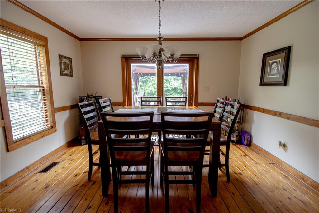 325 South Edgewood Road Eden, NC 27288 - Photo 11 of 29 view of dining room from living room, large cased opening, wood floors