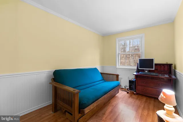 a room with furniture and a wooden floor