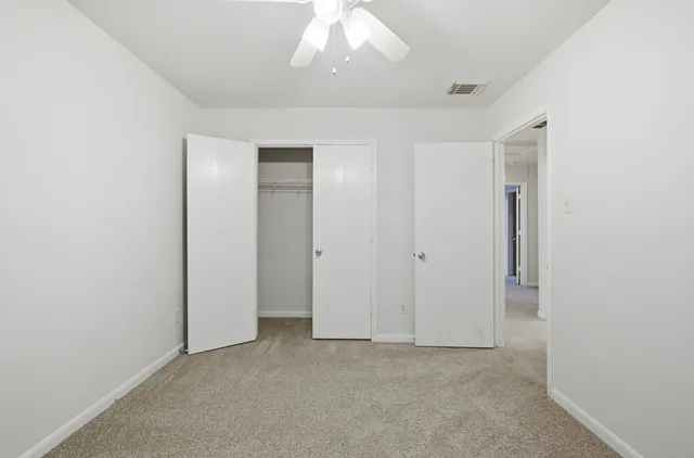 an empty room with a bathroom