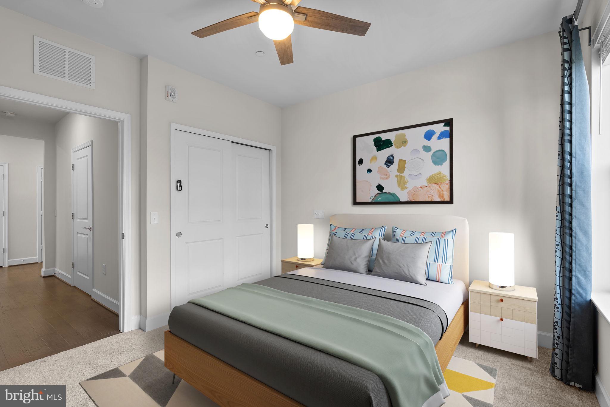 2960 Vaden Drive, Unit 2312 Fairfax, VA 22031 - Photo 15 of 46 a bedroom with a bed and a painting on the wall