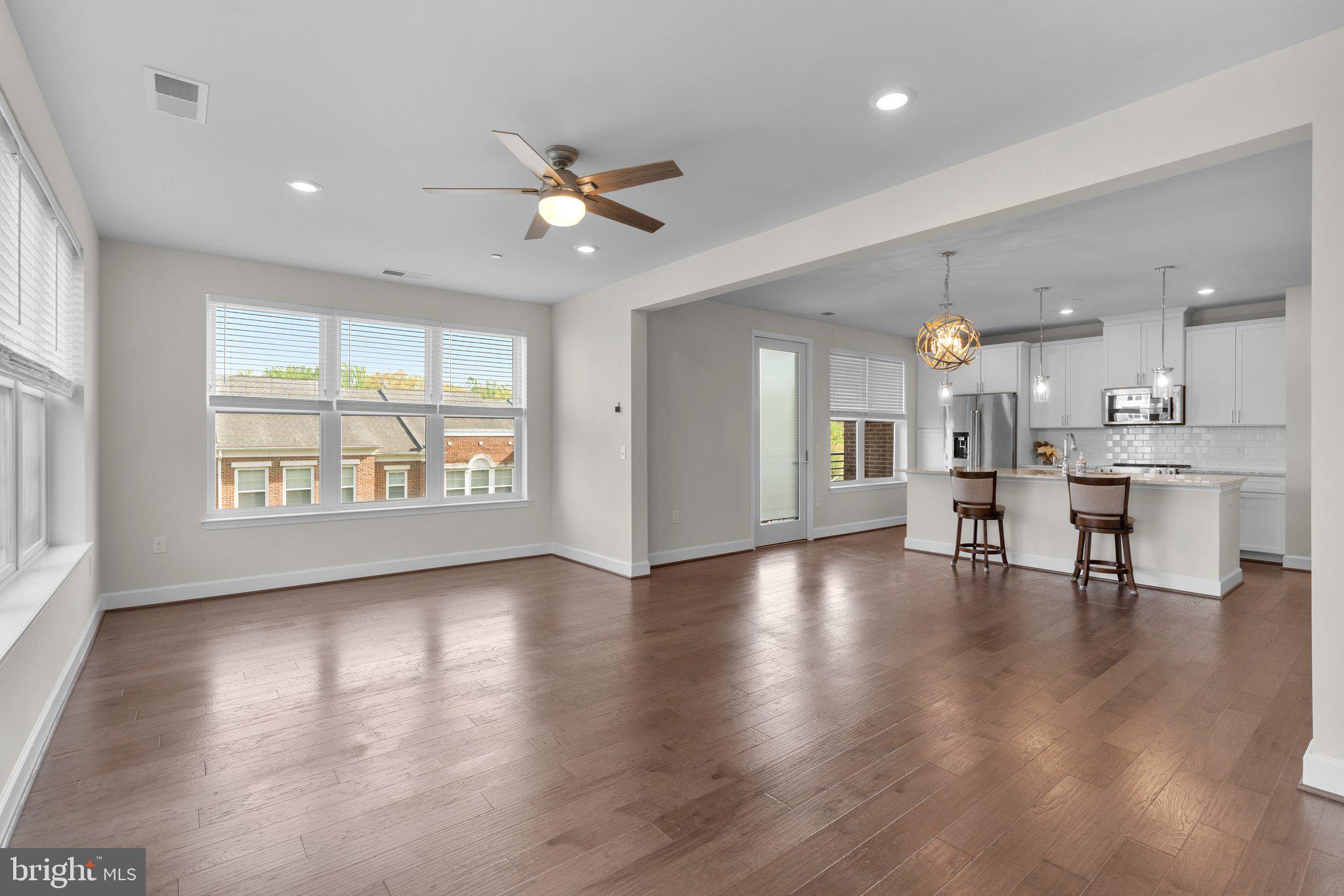 2960 Vaden Drive, Unit 2312 Fairfax, VA 22031 - Photo 18 of 46 a view of an empty room and window with wooden floor