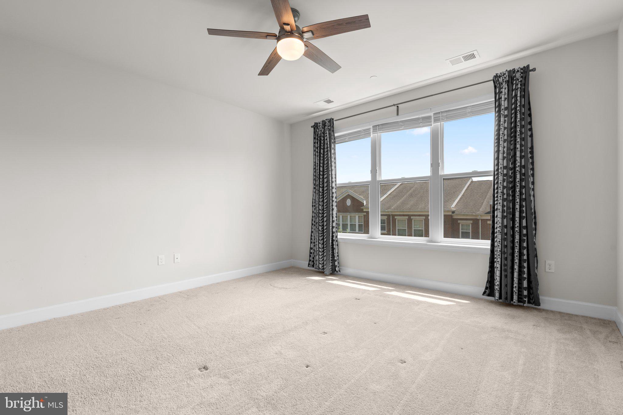 2960 Vaden Drive, Unit 2312 Fairfax, VA 22031 - Photo 26 of 46 a view of an empty room with a window