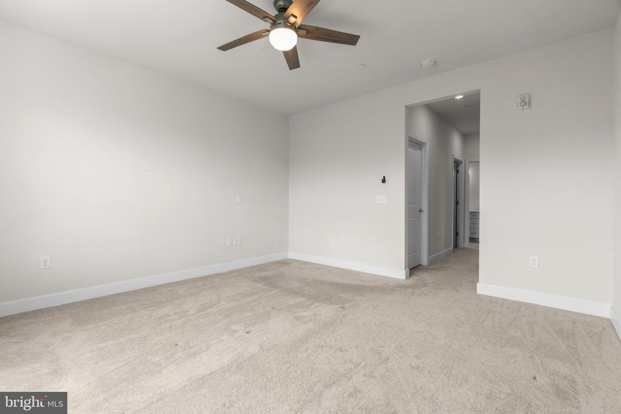 2960 Vaden Drive, Unit 2312 Fairfax, VA 22031 - Photo 28 of 46 an empty room with a fan and a window