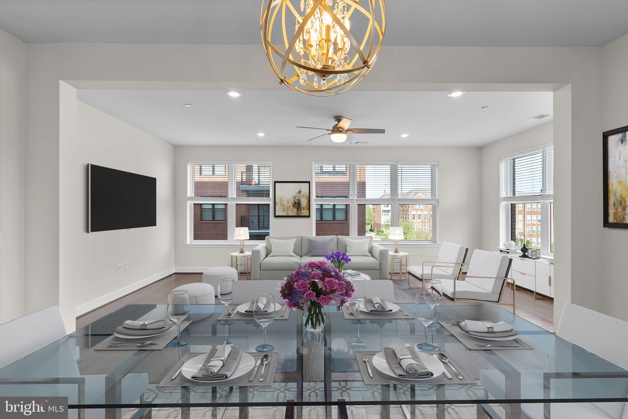 2960 Vaden Drive, Unit 2312 Fairfax, VA 22031 - Photo 3 of 46 a living room with furniture and a flat screen tv
