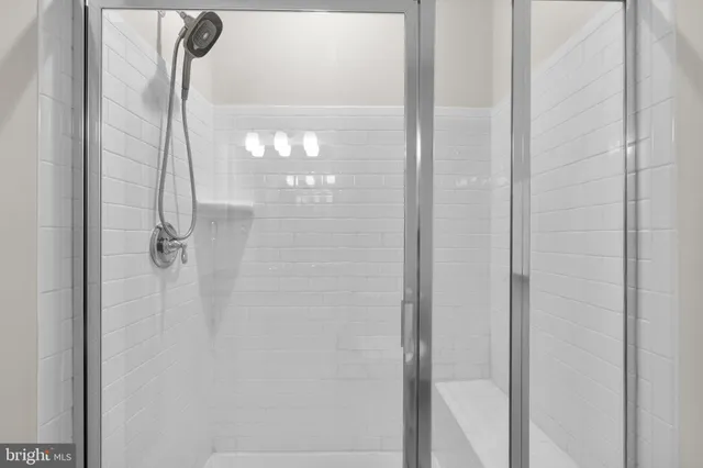 a bathroom with a glass shower door