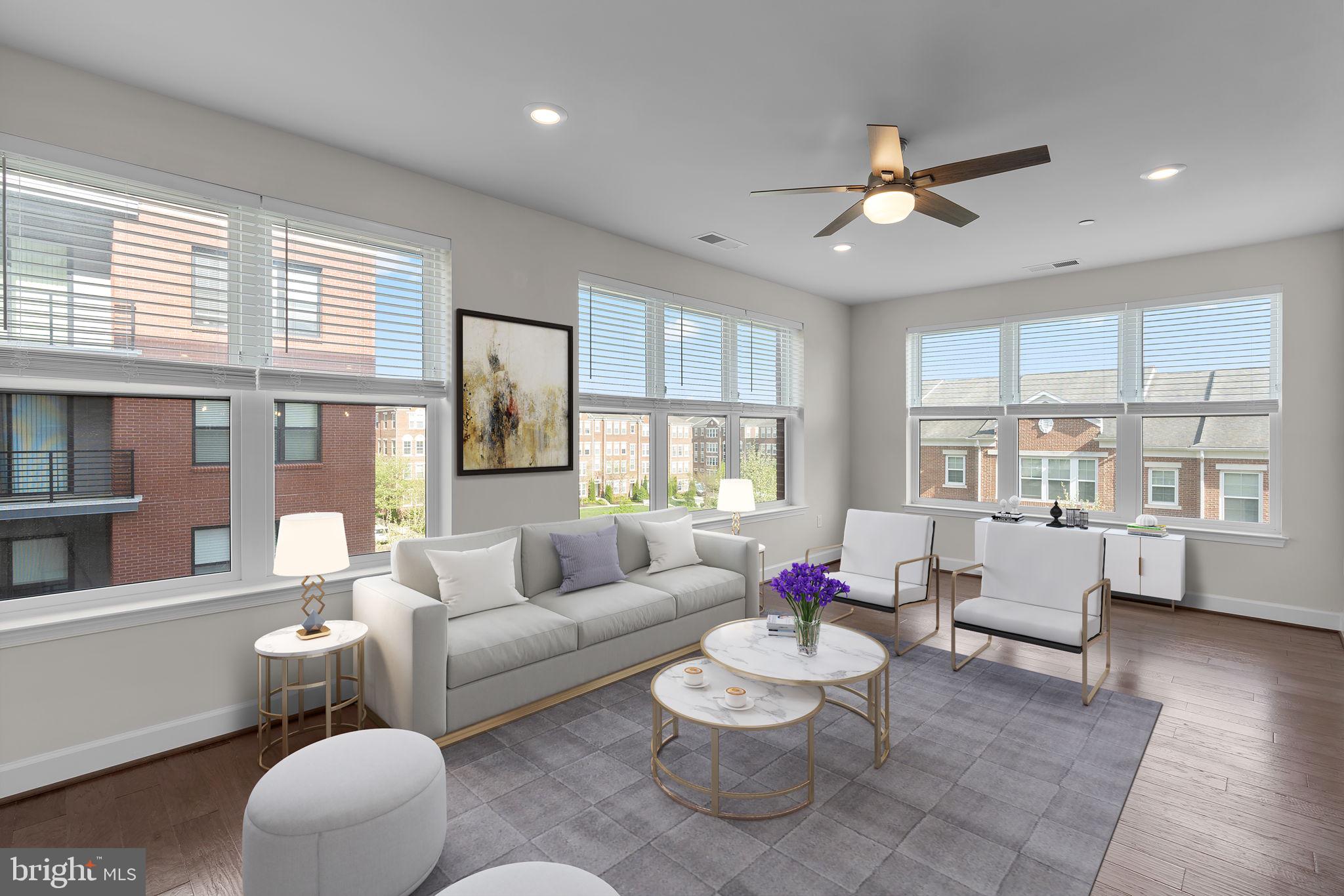 2960 Vaden Drive, Unit 2312 Fairfax, VA 22031 - Photo 4 of 46 a living room with furniture and a large window