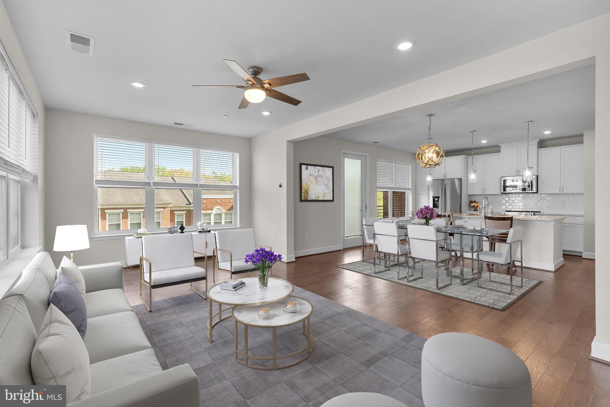 2960 Vaden Drive, Unit 2312 Fairfax, VA 22031 - Photo 5 of 46 a living room with furniture and a large window