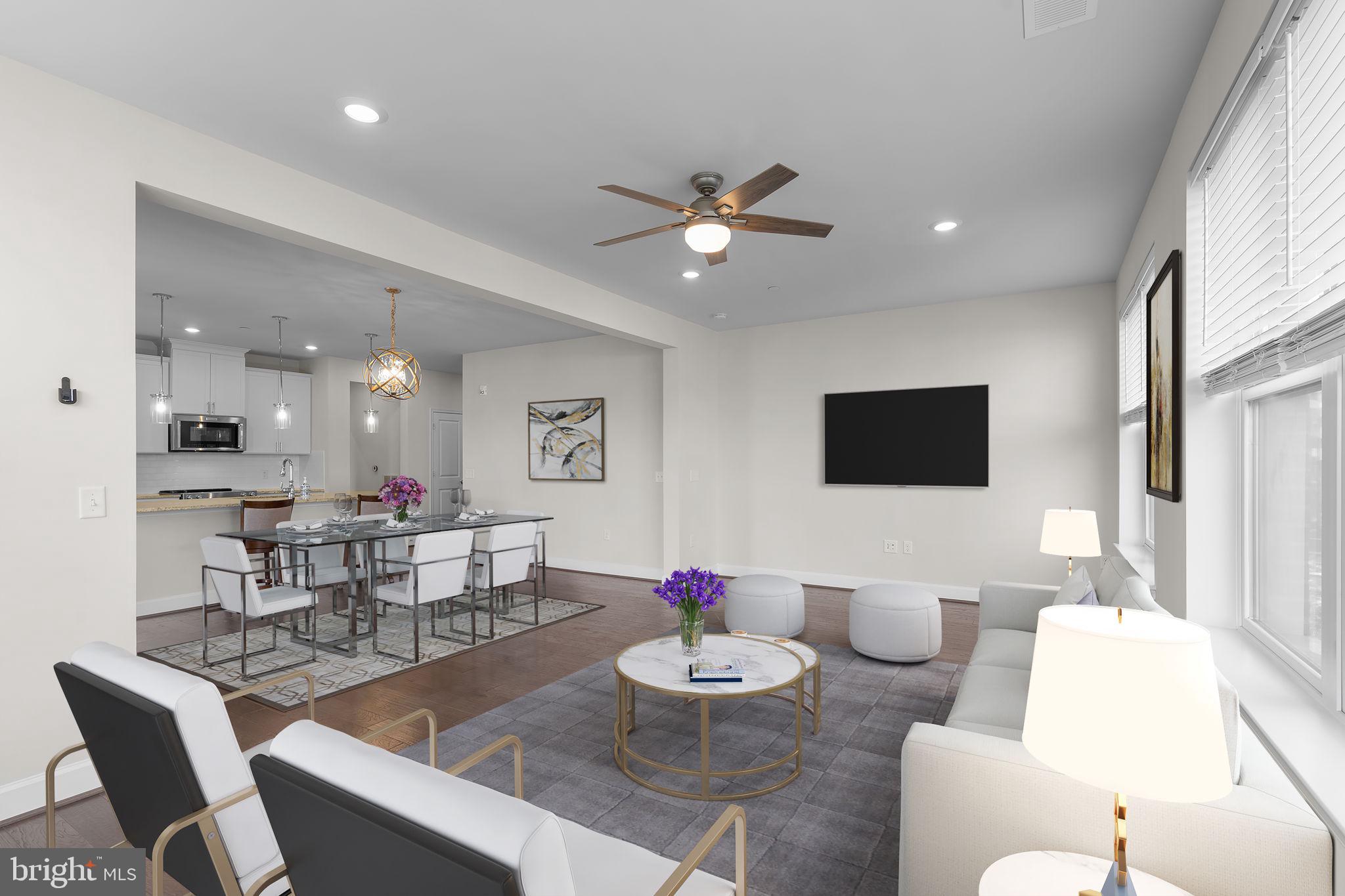 2960 Vaden Drive, Unit 2312 Fairfax, VA 22031 - Photo 6 of 46 a living room with furniture and a flat screen tv