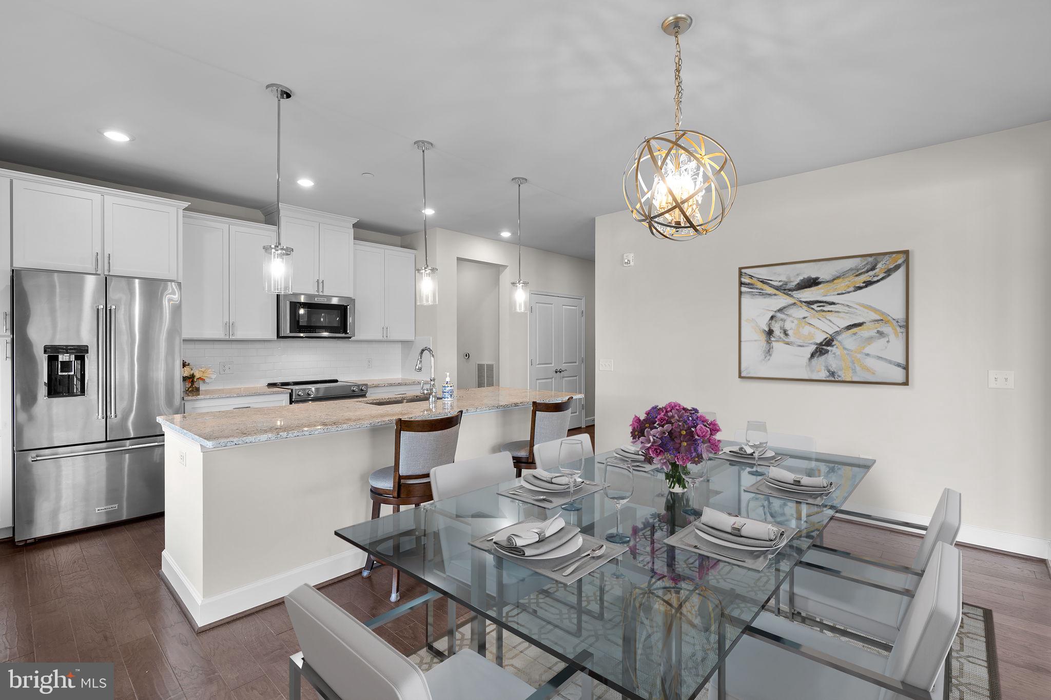2960 Vaden Drive, Unit 2312 Fairfax, VA 22031 - Photo 8 of 46 a very nice looking dining room with kitchen island stainless steel appliances